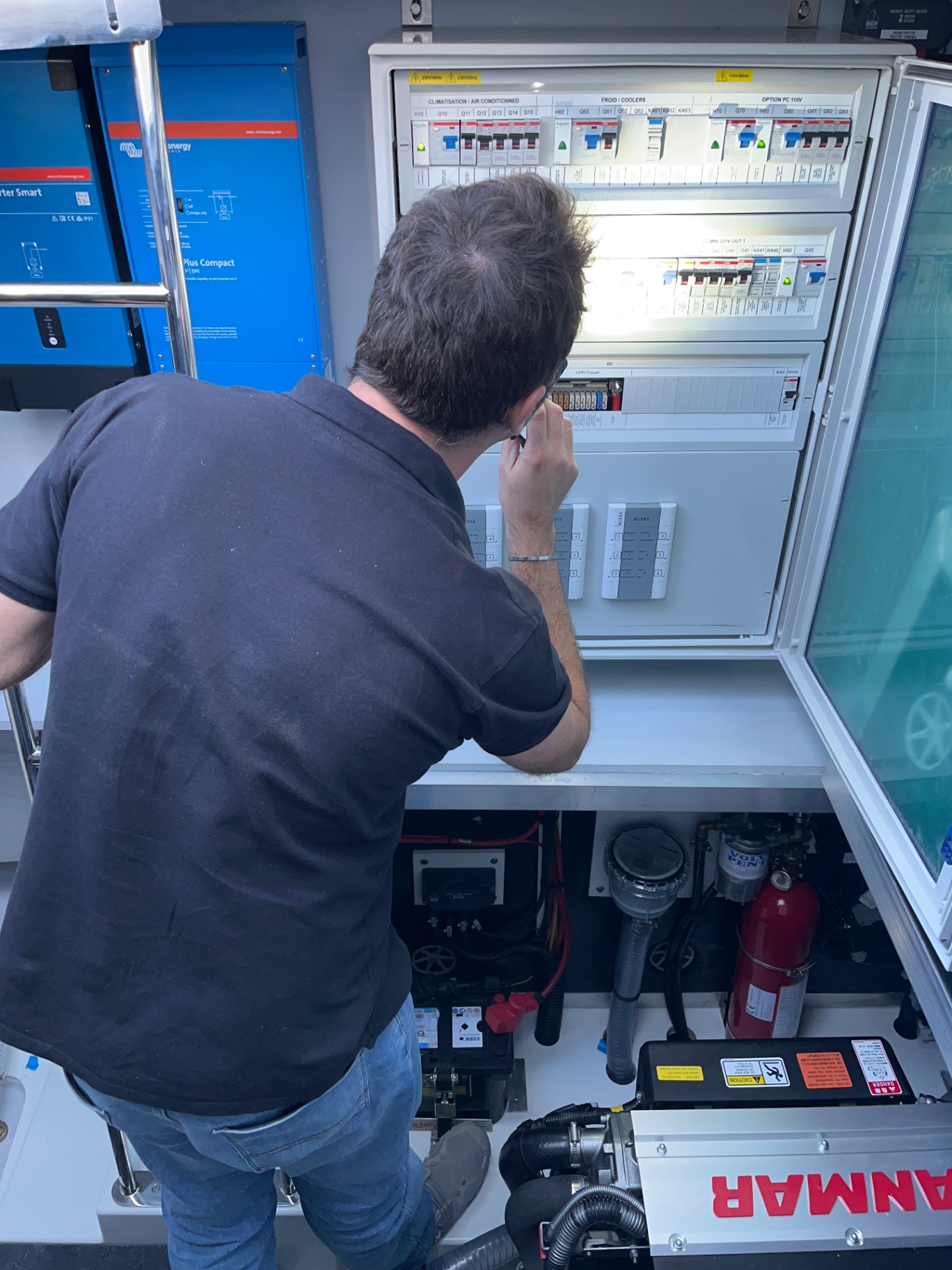 Yacht electrical systems survey — Victron inverters and main distribution panel inspection