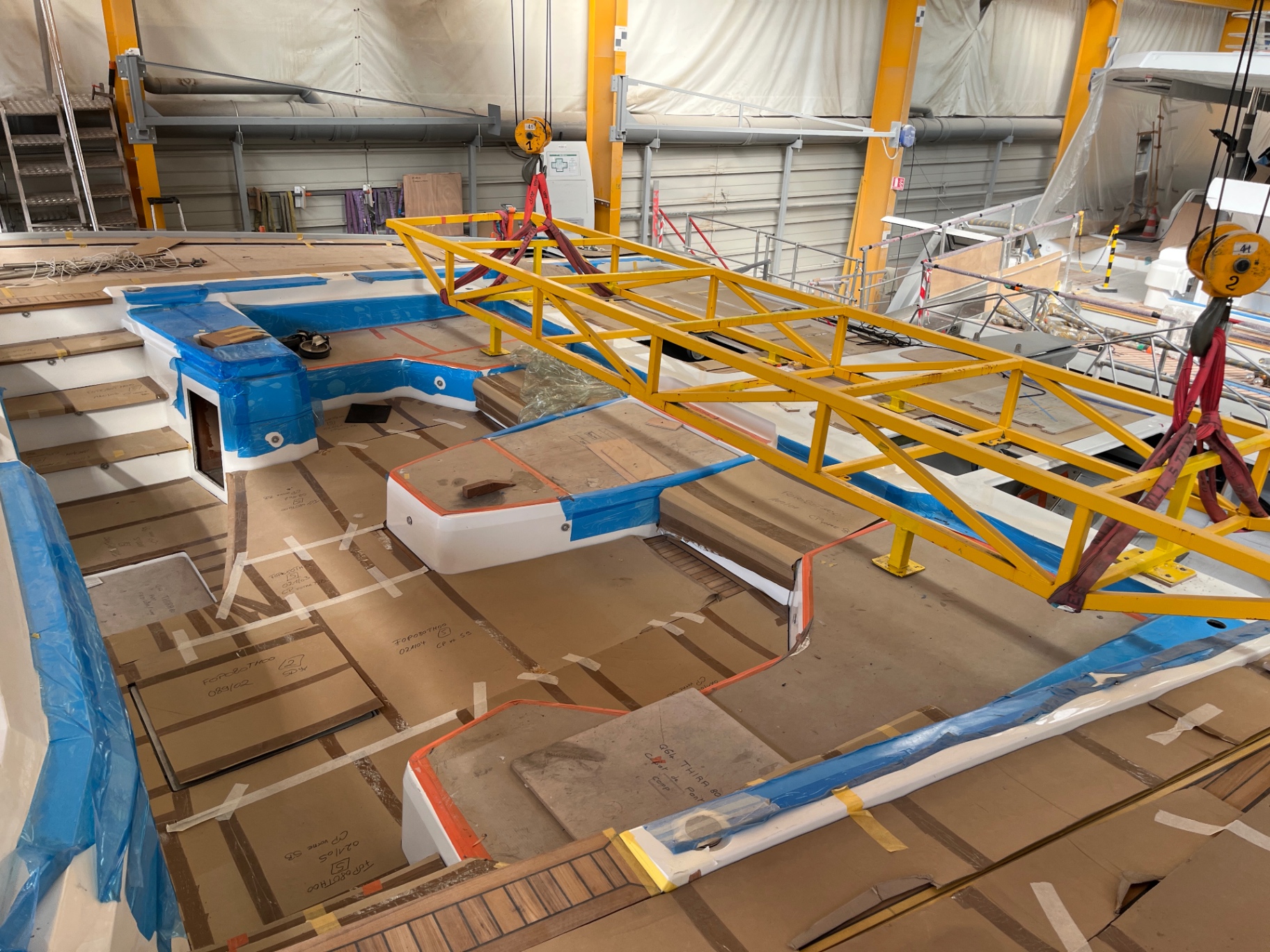 Superyacht deck monitored during fit-out — new-build yacht surveyor site visit